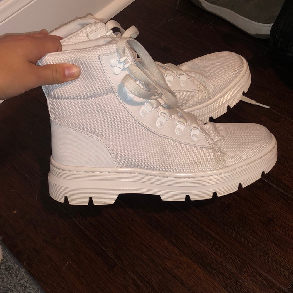 Doc marten combat boots. There are a few areas of discoloration. Size 8